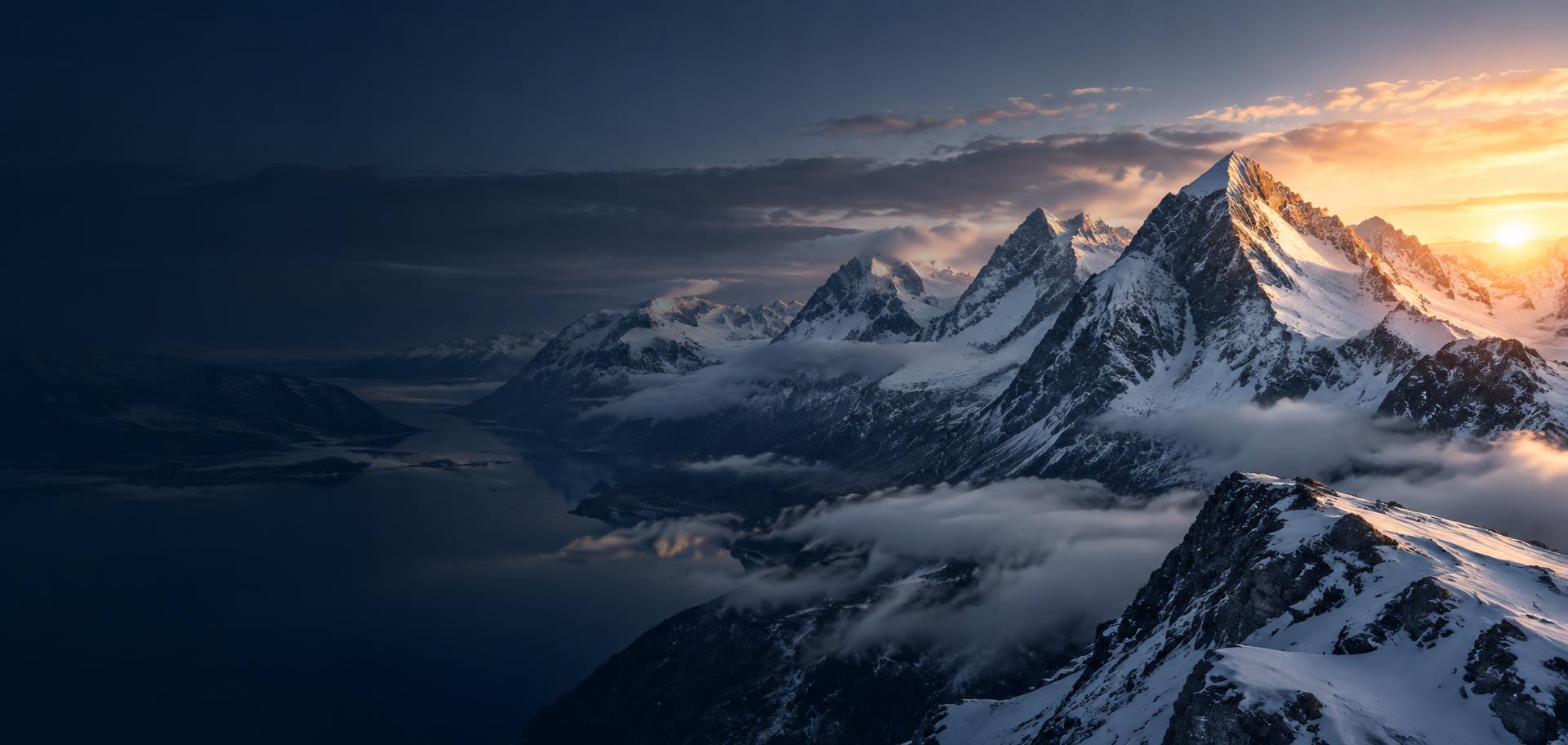 Snow-covered mountains at sunrise